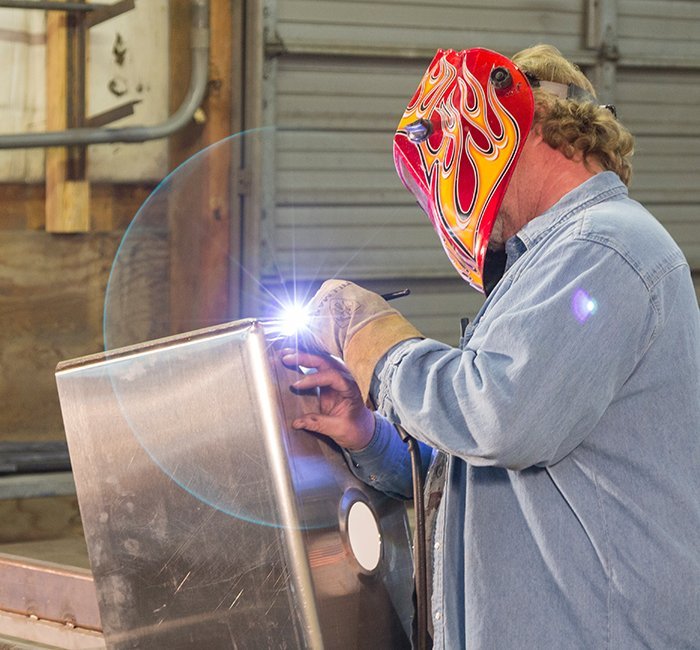 welding further back with flame helmet